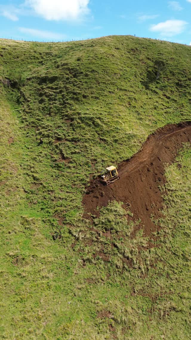 Cutting in a new farm track on steep hill country to improve mustering access. Practical access make…
