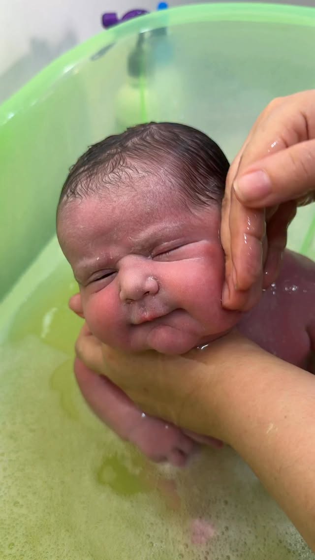 Baby happy with first bath