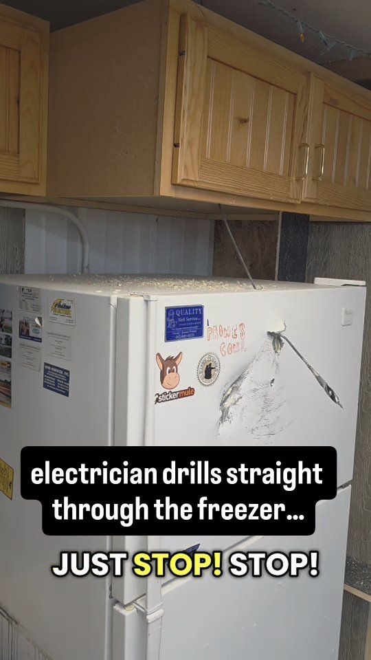 When the electrician misses… and drills right through the freezer.