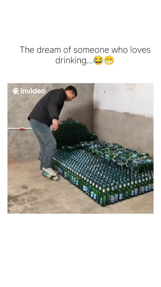a short video of a man meticulously stacking hundreds of green Heineken beer bottles into a makeshif…