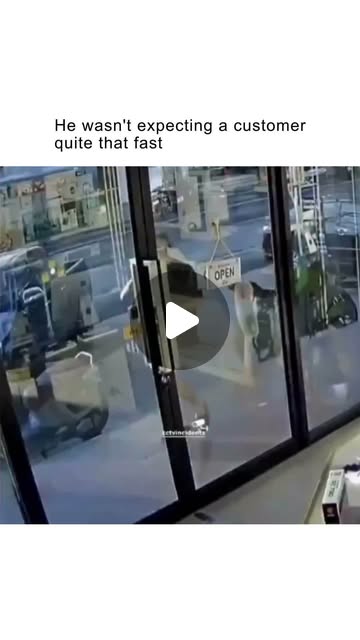 The video shows CCTV footage from an electronics store, likely in Thailand, where a young employee i…